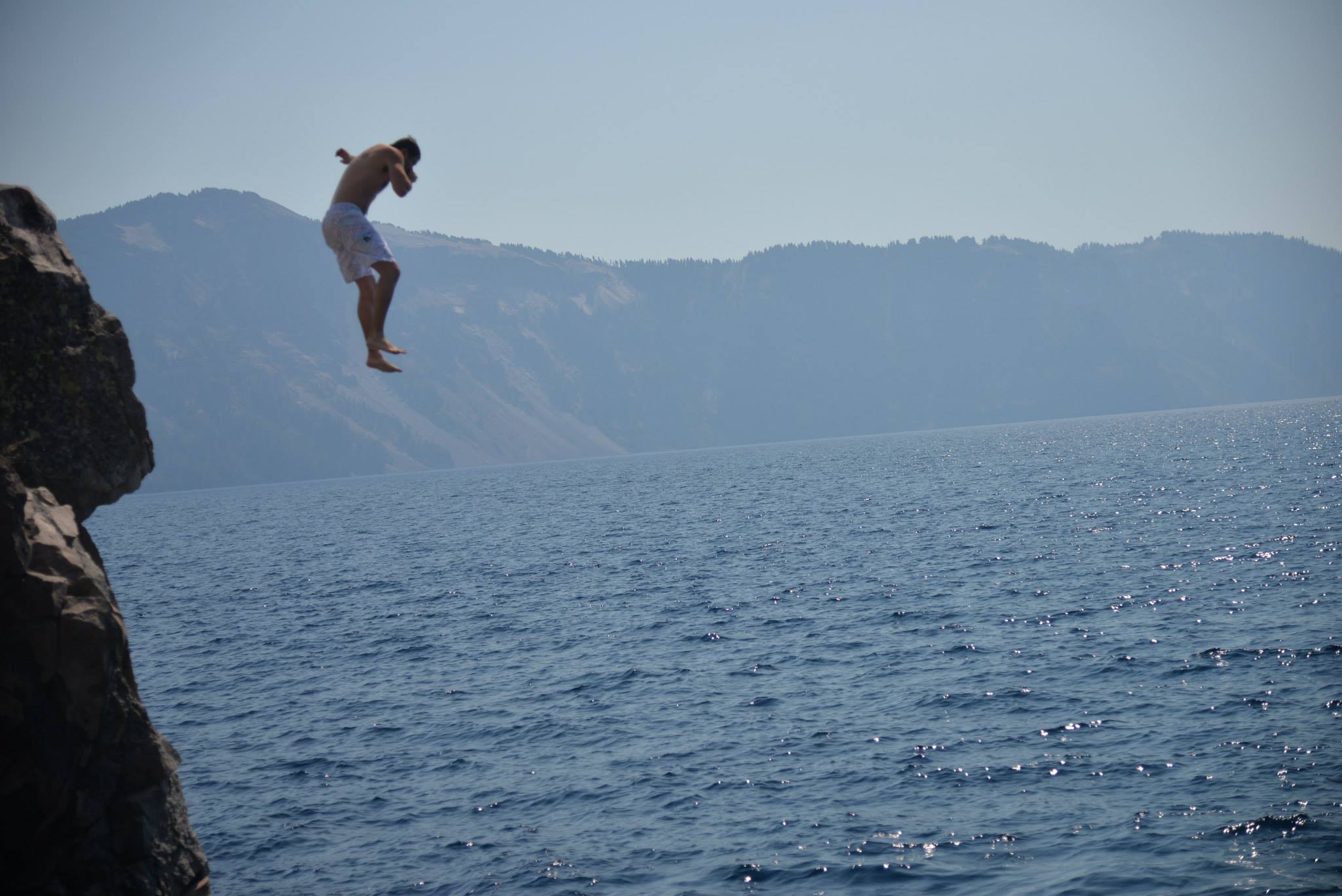 Cliff jumping into Crater Lake, Oregon